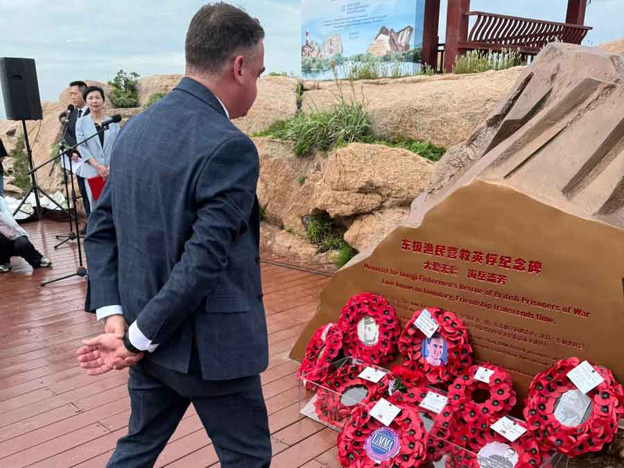 Anthony Jones, Chairman of LiMMA, laying a wreath at the memorial to recognise the courage of the Dongji Fishermen who rescued hundreds of POWs from the sinking of the Lisbon Maru in 1942. The memorial was unveiled on 20th May 2025 on Qingbang Island, South East of Shanghai, near the scene of the sinking. Photograph courtesy of Kent Shum.  