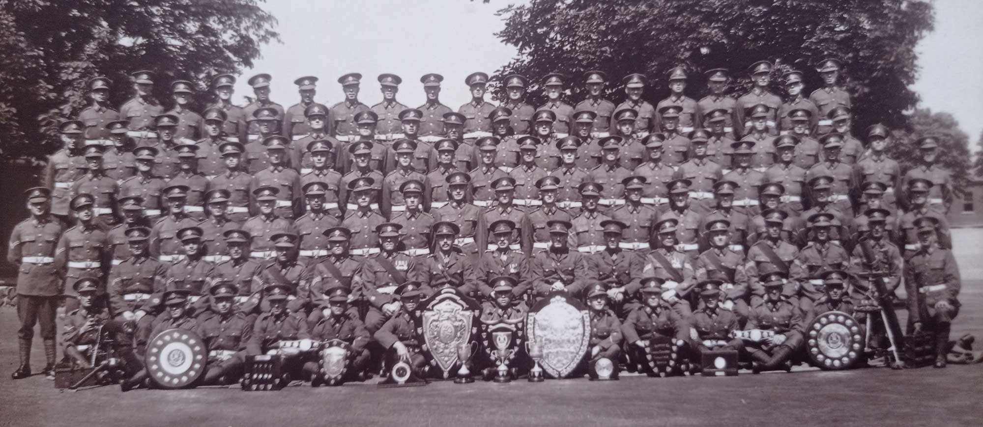 John Douglas Haig Weaver with the Middlesex Regiment. The reverse of this image reads: Middx Regt. John is in the third row from top eight from left.
