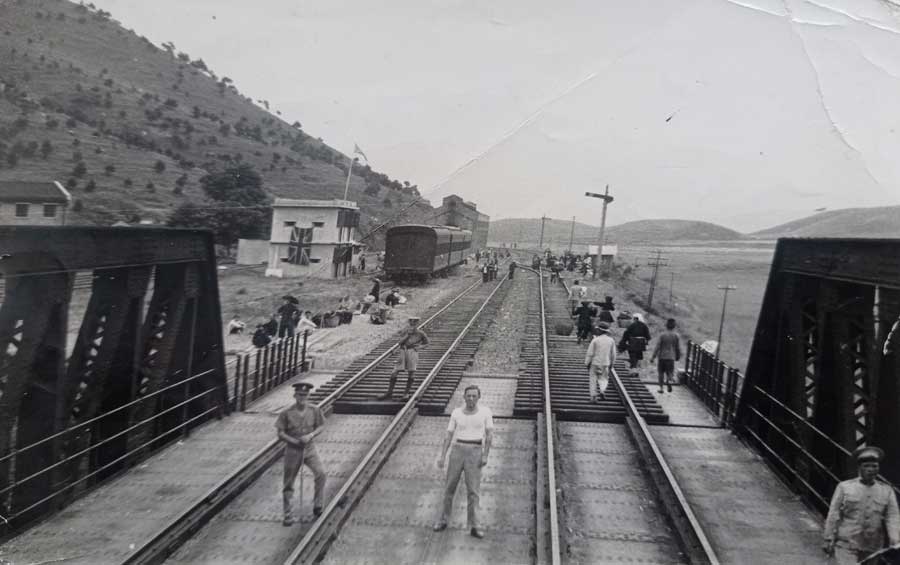 John Douglas Haig Weaver at a border post 1939. John is on the left in the foreground wearing a cap, holding a stick. The reverse is shown in the next image.