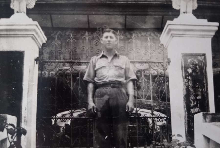 John Douglas Haig Weaver while in Singapore. Reverse reads: My self taken in door way of chinese temple