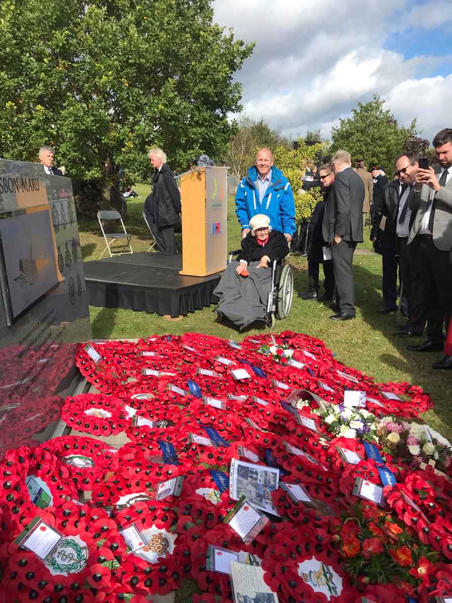 Jean Mead and Duncan Mead, Harvey Pressley's daughter and grandson at the unveiling of the Lisbon Maru Memorial at the National Memorial Arboretum in Alrewas near Lichfield, Stafforshire, England in 2021. Harvey Pressley was lost in the sinking of the Lisbon Maru.