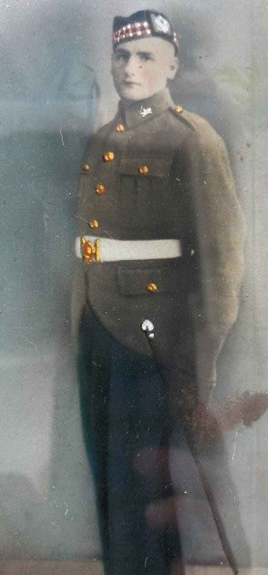 John Donnelly, who was lost on the Lisbon Maru. This photo was created by my father, Simon, John’s brother.  It is a cut out from an enlarged copy of the three Royal Scots recruits, which he then painted.  It was mounted in a mirrored frame and had pride of place above our fireplace, for over 50 years.